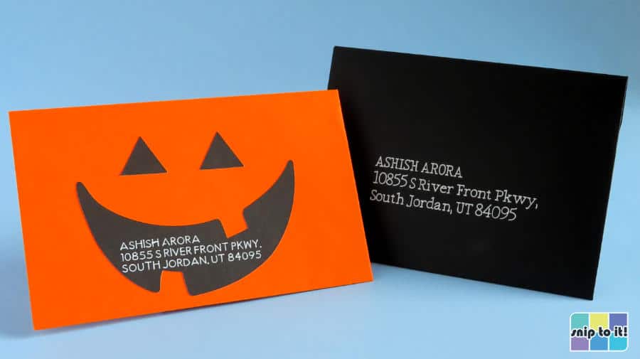 Finished envelopes with addresses written with white opaque gel pen