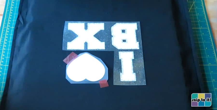 setup of the second press - glitter letter outlines and the stripflock base for the heart