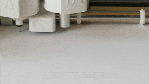 gif of criut machine drawing a single line font