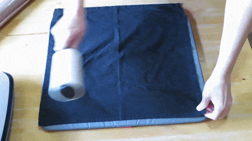 gif of lint rolling and pre-pressing fabric blank
