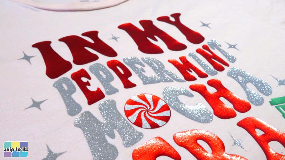 closeup of in my peppermint mocha era shirt, showing how sparkly and shiny the htv is