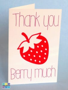 photo of Design Space practice project, a card saying "thank you berry much" with a strawberry on white cardstock