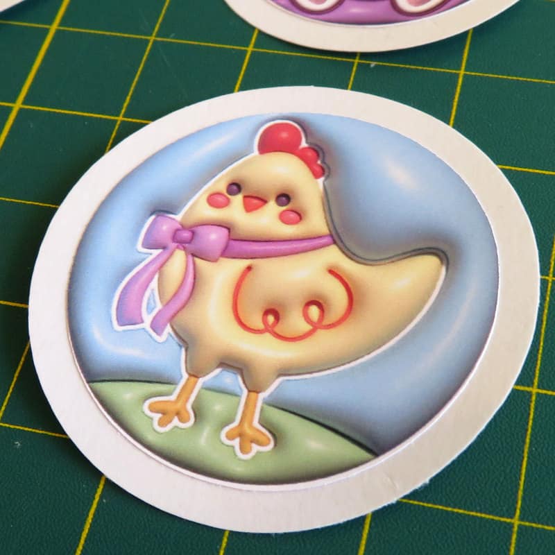 closeup photo of die cut 3d spring chicken sticker