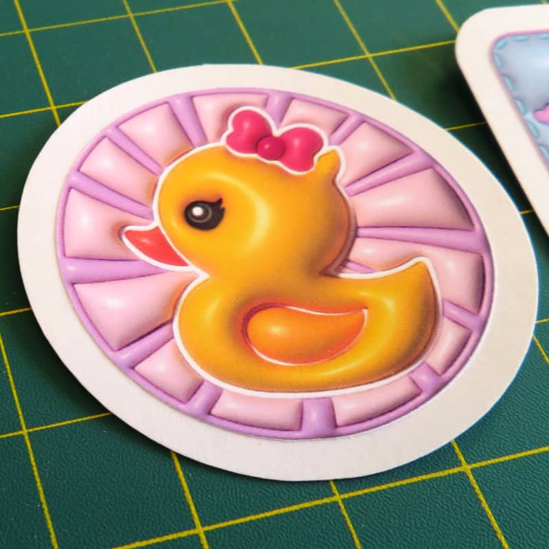 closeup photo of die cut 3d cute rubber duckie sticker