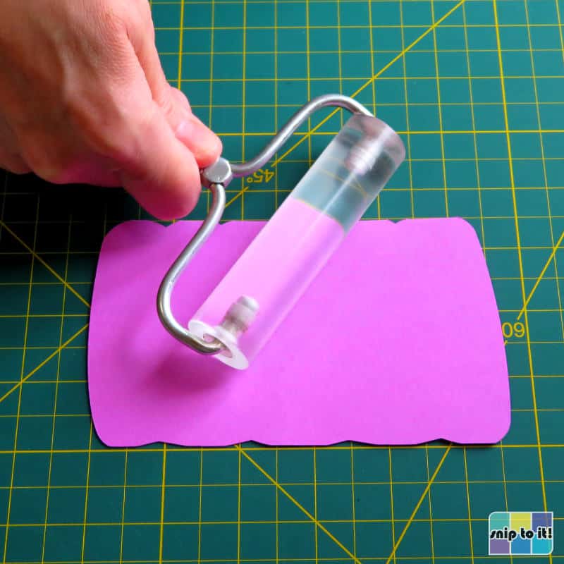 folding and flattening the card base along the score line