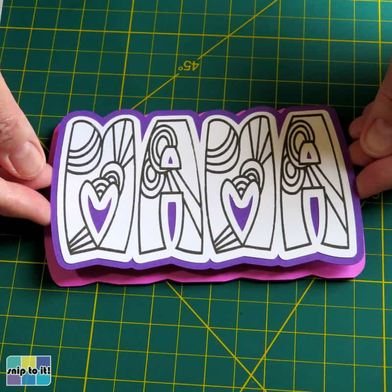 placing top and middle layers onto card base