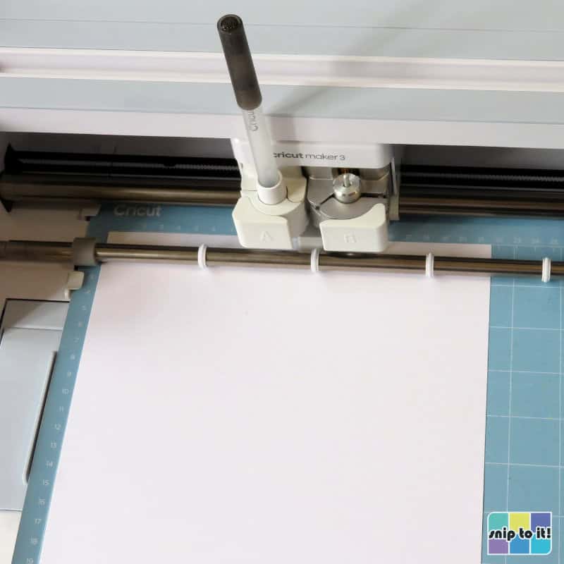 photo of Cricut Maker 3 set up for drawing and cutting white cardstock for MAMA card