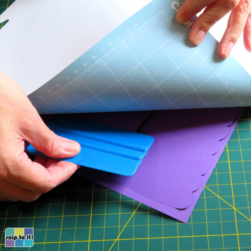 photo of removing purple cardstock from cutting mat after cutting offset layer for mama card