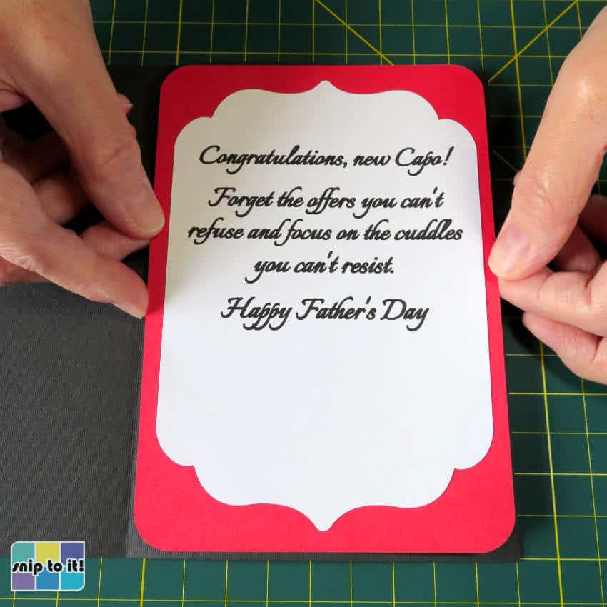 photo of inner sentiment panel + red cardstock layer being applied to card base to finish making Godfather Father's Day card