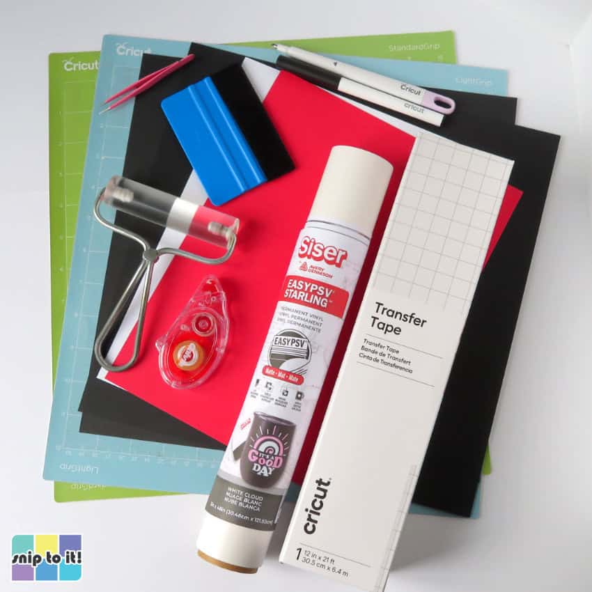 closeup of cricut mats, cardstock, vinyl and tools needed to make the father's day card