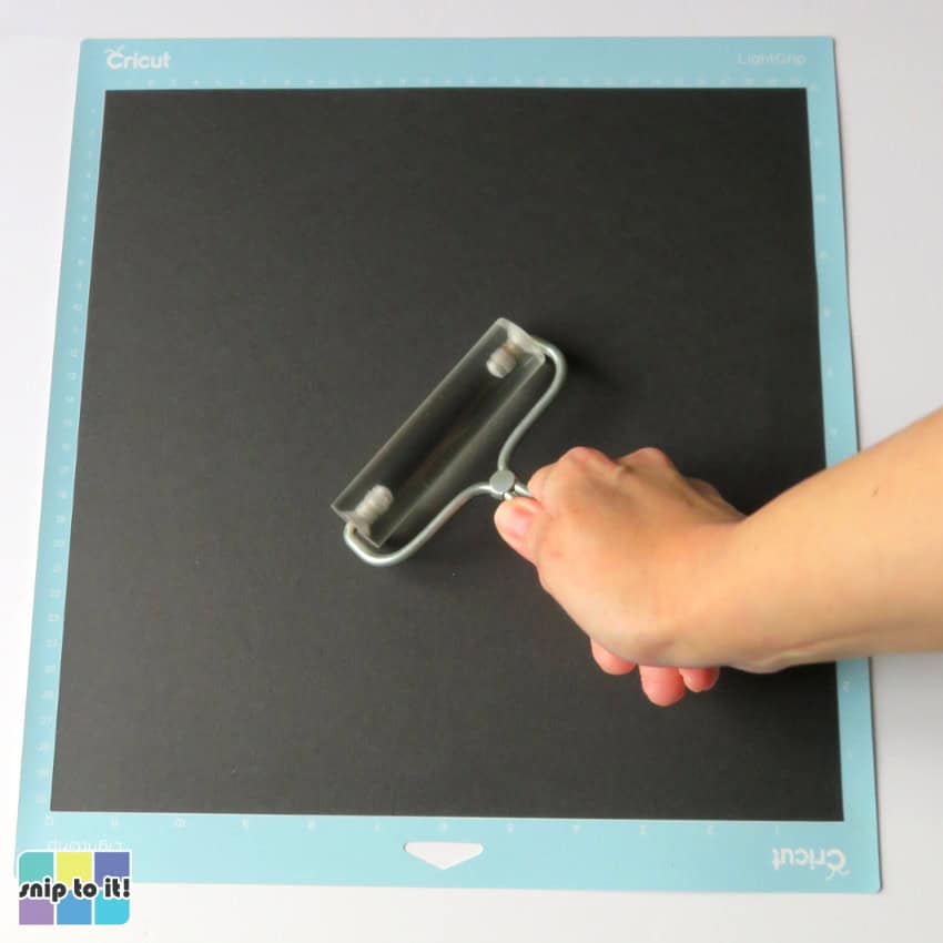 12 x 12 cardstock sheet applied to cricut lightgrip mat and rolled with an acrylic brayer for stability
