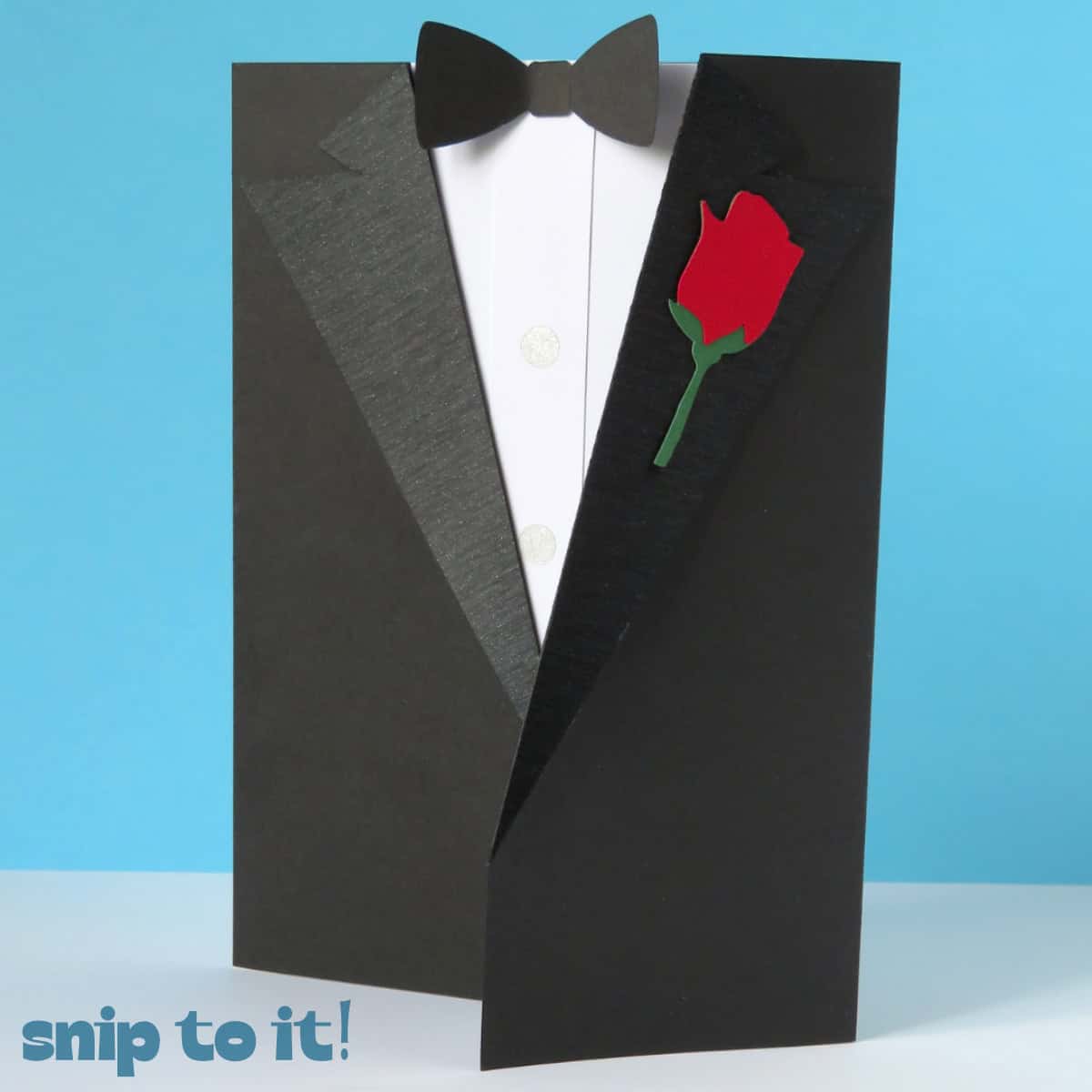 image of a greeting card envelope in the style of a classic black and white tuxedo with a paper rose in the lapel