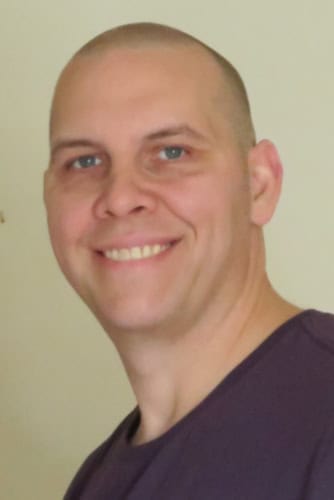 original photo of a smiling bald man that will be the basis of the sniptoit.com photo to SVG tutorial