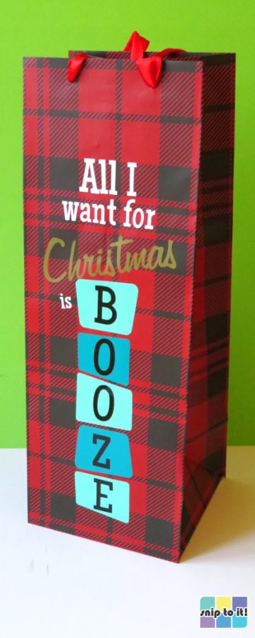 buffalo check print wine bag decorated with a mid-century modern style captioned "all I want for Christmas is booze"