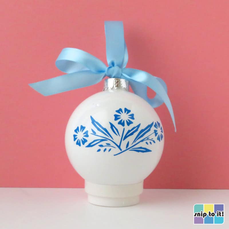 white christmas bauble decorated with blue vinyl in corningware cornflower pattern