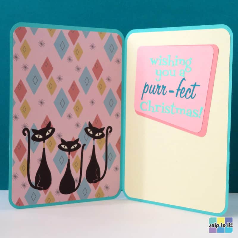 inside of vintage style atomic cat christmas card featuring a print & cut of 3 more cats with the sentiment "wishing you a purr-fect christmas!" in vinyl lettering
