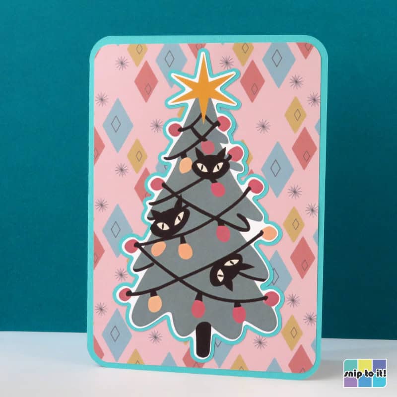 print and cut card featuring mid century atomic cats in a vintage tree with a diamond pattern background