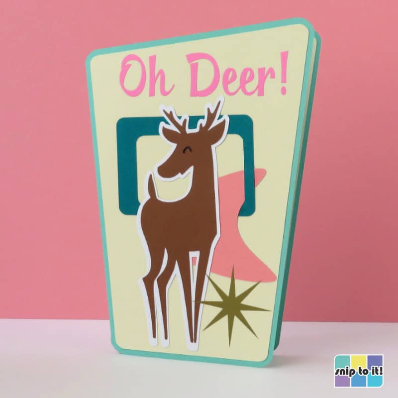 mid century-inspired card made in skewed rectangle shape with stylized deer, starburst, boomerang amd rectangle shapes