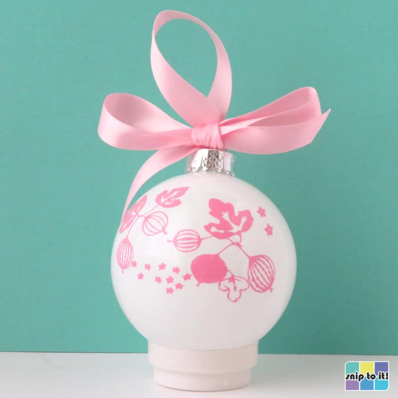 white christmas bauble decorated with pink vinyl in pyrex pink gooseberry pattern