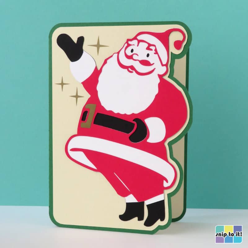 photo of mid century style christmas card project with gesturing Santa and starbursts