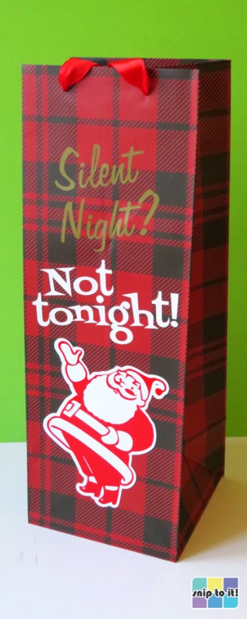 buffalo check print wine bag decorated with a mid-century modern style santa claus declaring "Silent Night? Not tonight!"