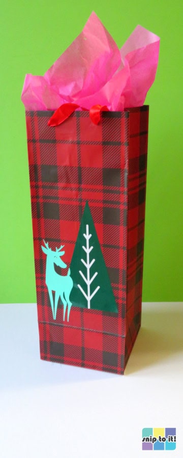 buffalo check print wine bag decorated with a mid-century modern style reindeer and christmas tree