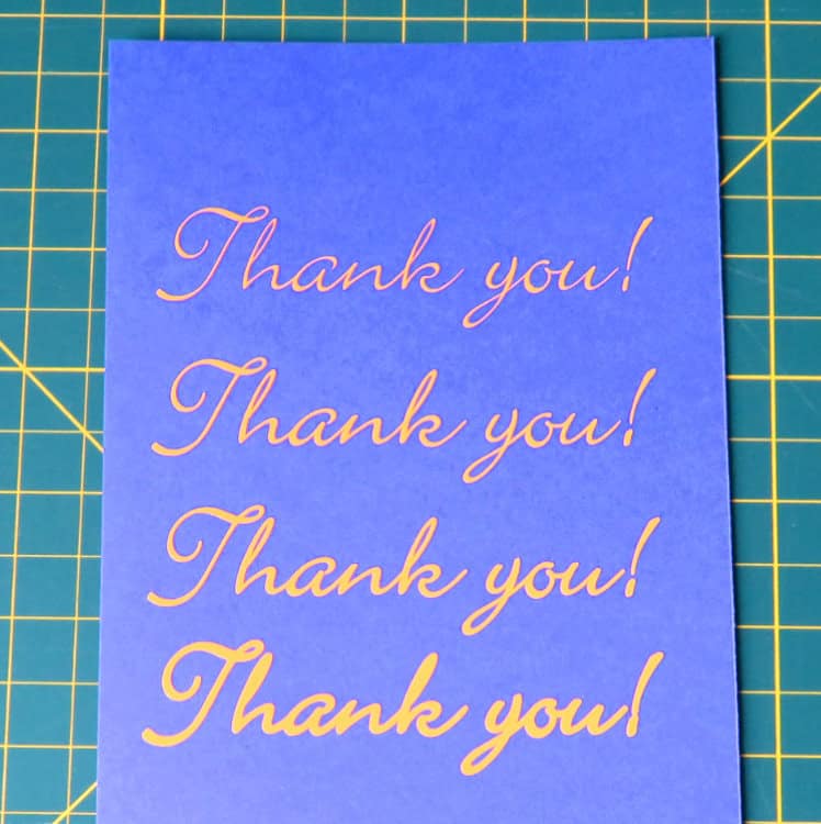 example of thin font made thicker using offset tool featuring text cut out of vinyl in progressively thicker strokes and applied to cardstock
