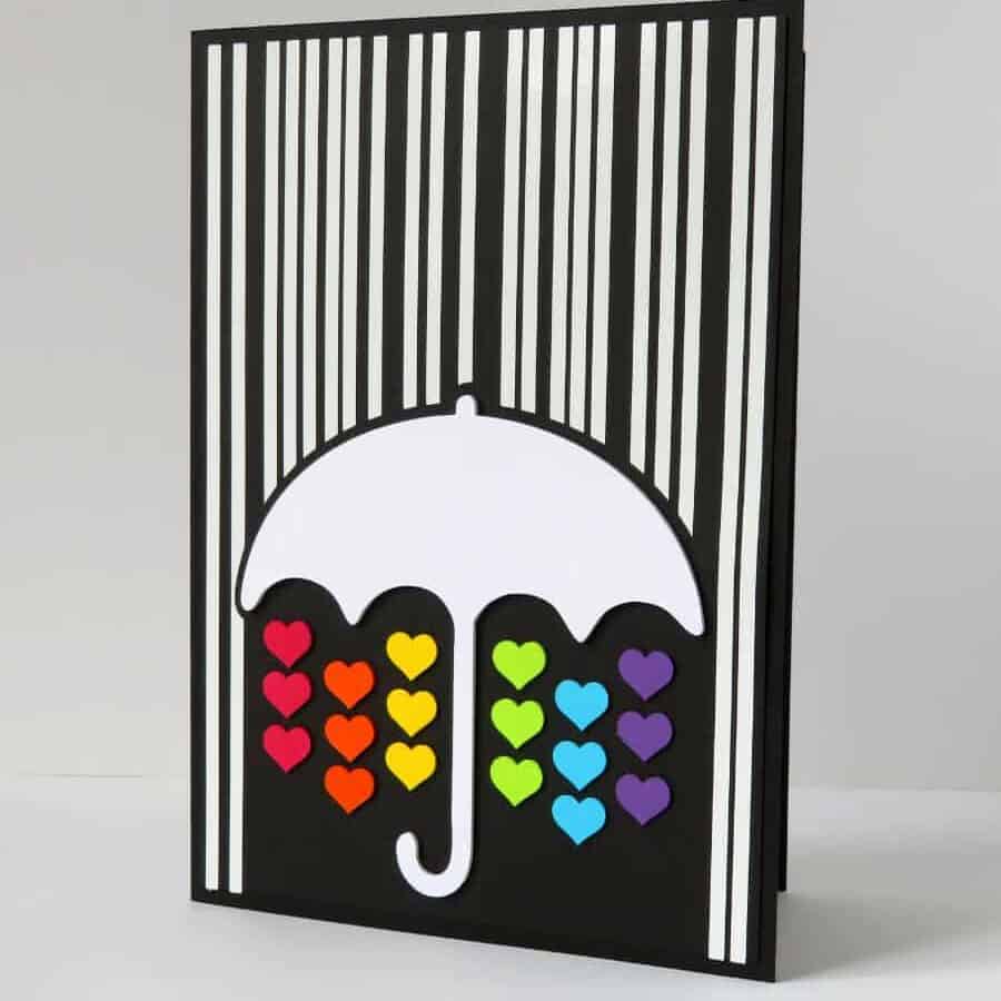 photo of card with image of umbrella under rain, showing use of offset to create space between design elements