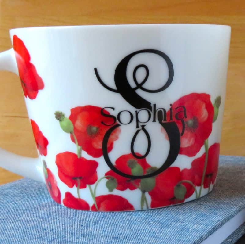 example of a coffee cup decorated with a monogram made using the design space Offset tool