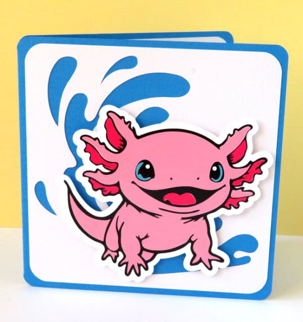 image showing the finished 4 color axolotl image made out of layers of cut vinyl and cardstock on the front of a greeting card