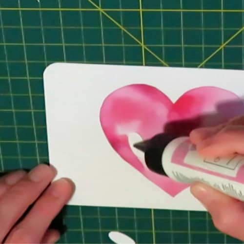 photo of adding spacer layers to the counter of the O in LOVE for the recessed text eclipse card