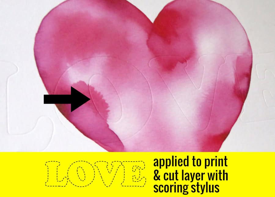 closeup photo of scored text on image base (watercolor heart image on a white background) for recessed text eclipse card