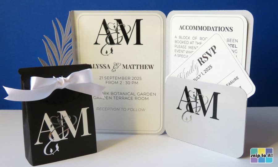 collection of wedding invitation and favor box emblazoned with an elegant intertwined monogram made from the engaged couple's initials