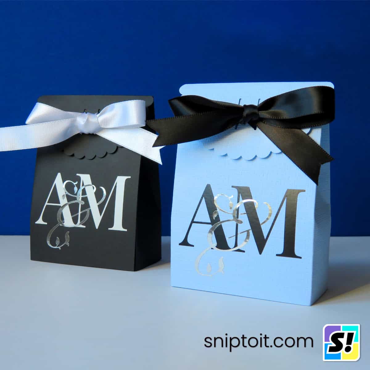 interwoven monogram feature image highlighting a favor box emblazoned with a custom monogram created using the couple's initials and a beautiful ampersand in a script font