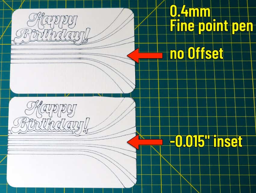 photo of 2 card panels with drawn guidelines for the design. Top panel is a direct copy of the design, and bottom panel has a pen guideline that is an inset of the original design