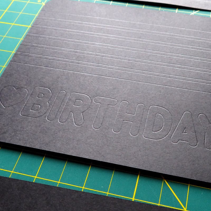 photo of inside base panel of rainbow birthday card showing scored guidelines for design placement