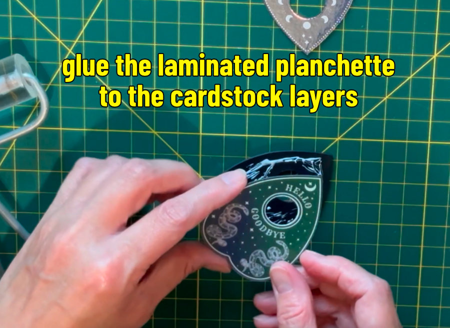 photo of gluing layers of cardstock together for the 3D planchette magnets