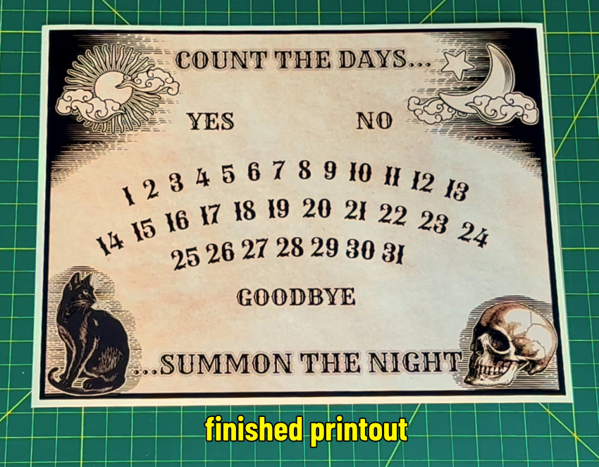 photo of printed ouija-inspired halloween countdown calendar on 8.5x11" Cricut Printable Magnet Sheet. The ink was dry coming out of the printer, and the print quality is very good
