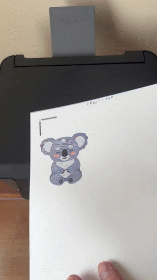 gif showing how the cardstock with a printed front image needs to be flipped over to print the back image for a double-sided print then cut project printed on a rear feed epson printer
