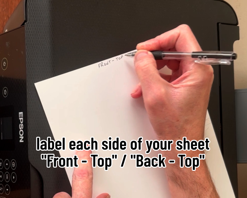 photo of labeling the front and back of the top of a sheet of cardstock for double sided print and cut