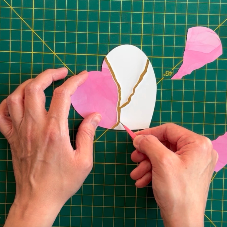 photo showing gluing in of the foiled gold piece for the kintsugi card