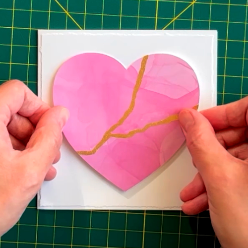 photo of kintsugi-inspired card, showing broken heart repaired with gold seams