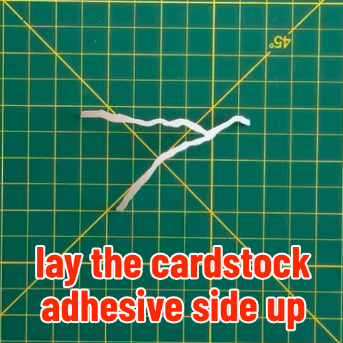 photo showing adhesive cardstock piece to be foiled and added to kintsugi card