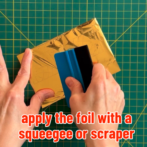 photo showing scrap Cricut foil sheet being used to foil adhesive cardstock piece for kintsugi card