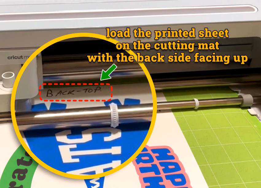 photo of 2-sided printed designs loaded on mat (back side up) and being cut by Cricut Maker 3