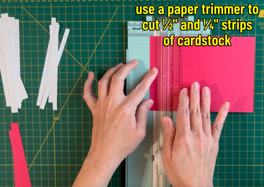 image showing a manual paper trimmer to cut cardstock into half and quarter inch strips. these strips will be assembled into a piece of custom striped cardstock for the inlay card