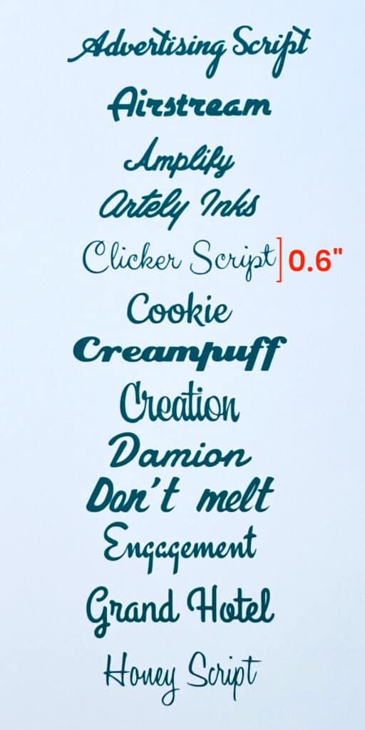 photo of cursive mid century fonts, cut out of Cricut Value Vinyl in Teal and mounted on white cardstock. Line height of Clicker Script is noted for scale, 0.6"