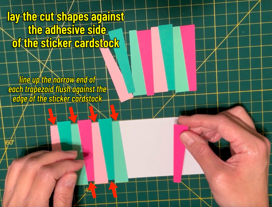 trapezoid shaped strips of pink and green cardstock being laid across a rectangle of adhesive sticker cardstock to create a mid-century themed card front panel