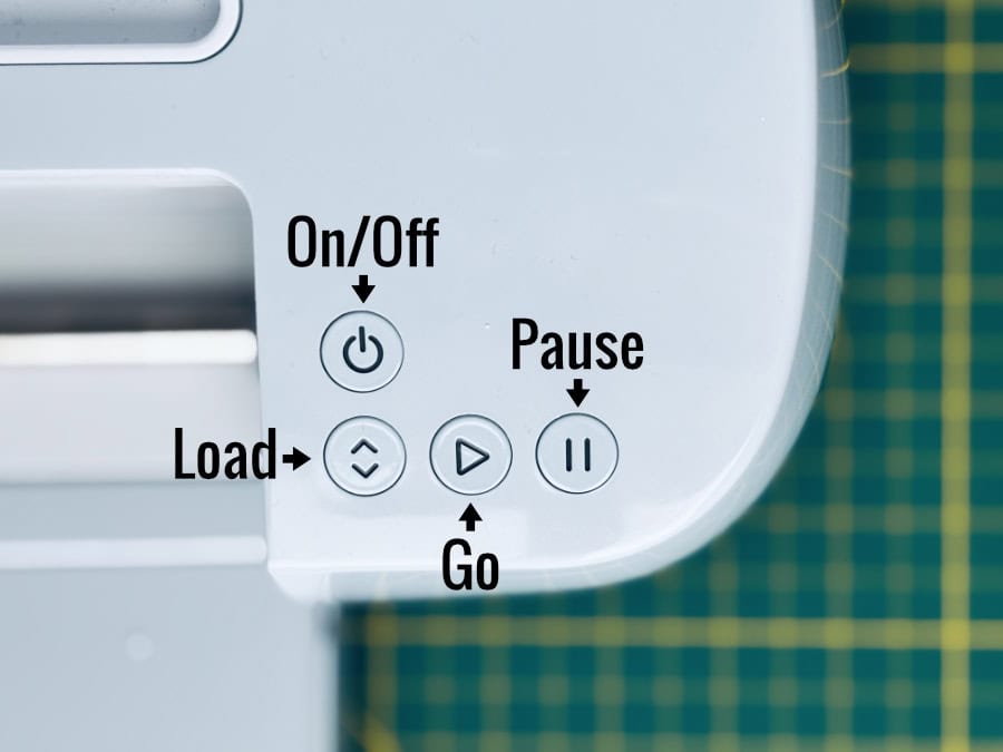 closeup of the Cricut Maker 3 operation panel, with the power, load, go and pause buttons labeled