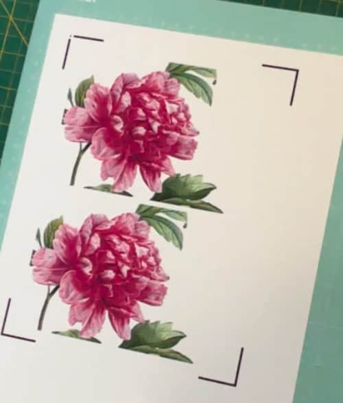 photo showing printed eclipse card base panel + panel for top printed text. Both panels look identical at this point, a pink peony on a white squircle base. Both panels fit on one 8.5x11" sheet of glossy printable 80lb cardstock.